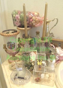 lot 589 image: Assorted dcor including swan handled pedestal urn vases, brass & crystal candle holders, butterfly mounts and more as shown