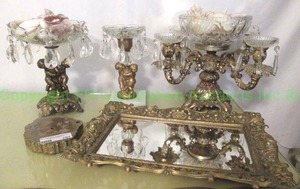 lot 707 image: Brass and crystal cherub figural centerpiece girandole and compote plus mirrored tray and bowl with shells as shown