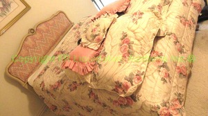 lot 711 image: French provincial serpentine carved fulldouble bed includes bedding items (Mattress free for the taking). Carved  upholstered headboard and footboard.