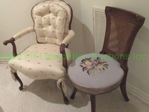 lot 729 image: Vintage chair duo. Includes double tufted claw foot arm chair and cane back chair with crewel upholstered seat