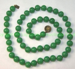 lot 558 image: Sterling Jade or Green Stone  Necklace 24L Marked Sterling