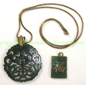 lot 561 image: Nephrite Disc Pendant on gold tone Chain. 22L Also includes a gold tone Nephrite Pendant. No markings.