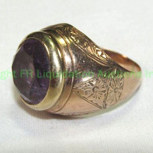 lot 563 image: Yellow Gold Ring with inset Purple Sapphire or purple stone (not Amethyst, tests more toward Sapphire) No gold markings Please Preview