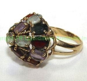 lot 564 image: Multi Gemstone High Dome Cabochon Ring. No markings. Size 8 May be gold. Please preview