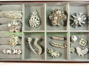 lot 609 image: All That glitters Rhinestone and Crystal glass jewelry plus jewelry case. Includes one CORO marked broochpin with faceted stones.