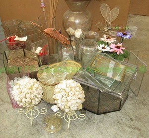 lot 181 image: Assorted glass planters, terrariums, metal painted tole planter, dcor and more as shown