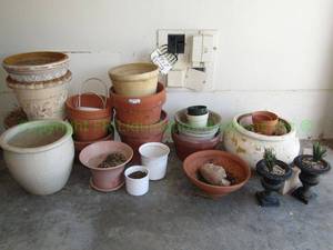 lot 201 image: Assorted terra cotta, stoneware, cast iron planters and gardening pots
