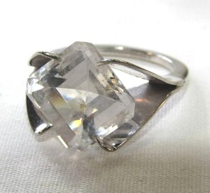 lot 417 image: 10K Gold MCM Abstract Mount Ring with Cushion Cut Stone set on  bias. Stone untested. Marked 10K  Size 6