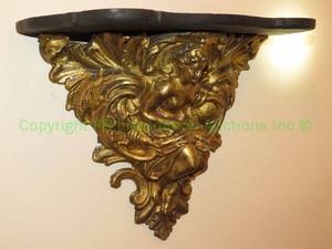 lot 652 image: Gold gilt wall sconce shelves, features female form with sceptre, scroll and acanthus leaves, matched pair, 12 tall
