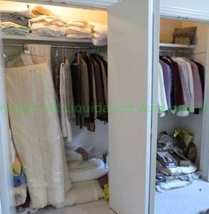 lot 658 image: Contents of closet including vintage Liz Baker (petite) vest & skirt, hanging clothes, shoes, textiles as shown