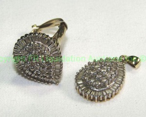 lot 418 image: 10K Gold and diamond teardrop ring & pendant duo. Ring marked 10K 1TW Rounds surrounded by baguettes. Size 6.5 approx. Appears to be 1 cttw for each Please preview
