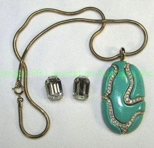 lot 613 image: Weiss Clip Earrings. Marked Weiss. Also included is an Eisenberg Blue enamel and crystal pendant on 18 chain