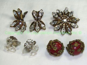 lot 616 image: Miriam Haskell Brooch and Clip Earring set with Marquise Shape Crystals. Also includes a pair of screw back earrings with clear flowers marked Haskell. Also includes one pair of earrings with vintage red centers and filigree Silesians wirework.