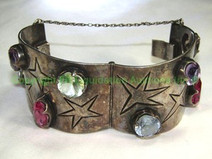 lot 618 image: VERY Heavy Taxco Sterling Silver Bracelet. Marked Taxco Sterling Hinged with safety chain. Multi gemstones prong set.