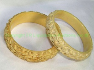 lot 623 image: Pair of carved bone bangle bracelets with Dragon motif carvings