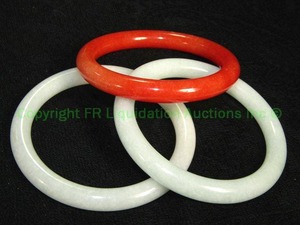 lot 627 image: 3 Jade Gemstone Bangle bracelets rounded Orange and 2 light green