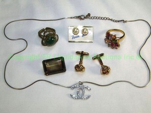 lot 663 image: Selection of Jewelry Including a vintage Silesians Wirework Ring (Western German), cufflinks in knot form, Vanna White pearl earrings on card, multi Gemstone Ring size 9.25, Large Smokey Quartz Stone (tested) Chanel Pendant on chain