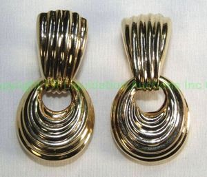 lot 665 image: 14K Gold Clip doorknocker earrings with removable hollow dangle. Marked 14K