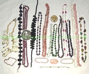 lot 675 image: Gemstone and rock jewelry. Includes a Howlite slab necklace, Blue Topaz Pendant, Smokey Quartz Pendant, Amethyst necklace, Rose Quartz necklace plus Includes a large chunk Sodalite Necklace, Amethyst chip bead necklaces and more