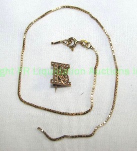 lot 676 image: 14K Gold Broken Box Chain 9L  Plus 14K initial Pin (Marked 14K)