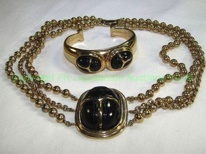 lot 678 image: Black enamel and gold tone Choker necklace 14 and matching cuff bracelet. Marked RL or RC