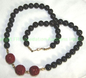 lot 679 image: Black onyx polished bead and cinnabar bead necklace 20L