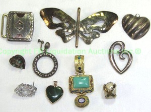 lot 798 image: Sterling jewelry selection. Includes Taxco 950 onyx heart pendant, Nunn Bros and more as shown