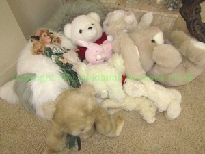lot 328 image: DanDee collectors choice porcelain doll and assorted stuffed animals