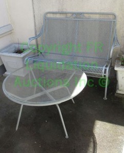 lot 783 image: Metal loveseat and glass topped table as shown. Planter boxes not included in this lot.