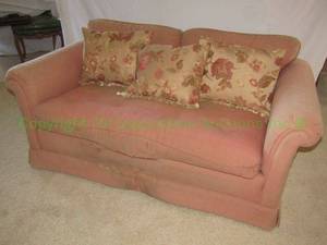 lot 360 image: Upholstered pillow back loveseat with 3 pillows. Upholstery has split in front