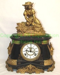 lot 383 image: Antique late 1800s Ansonia Clock Co. black marble and gold gilt mantle clock w winged mythological character mounts, 20 tall