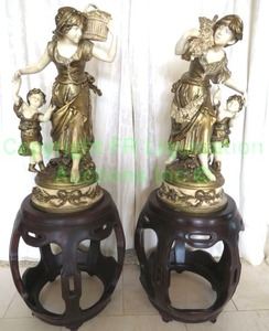 lot 85 image: After Auguste Moreau Woman With Child painted spelter metal vintage table lamp base figures atop Rosewood Garden Seats. 43 overall, Statues 26 (Bid is times the quantity of 2)