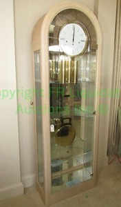 lot 300 image: Howard Miller display cased Grandfather clock model 610-684, late 20th Century, 27 x 13 x 82