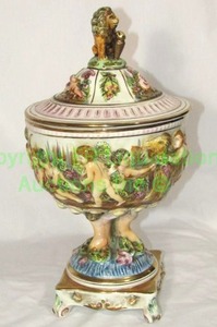 lot 751 image: Vintage R. Capodimonte porcelain lidded compote w cherub at play theme and figural lion finial made in Italy, 15 tall, marked