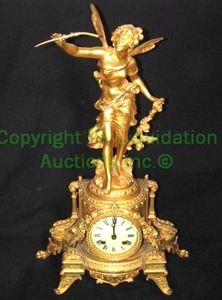 lot 746 image: French iconic mantle clock with two winding points and figural winged female fairy  cherub topper marked JB, 16 x 7 x 25
