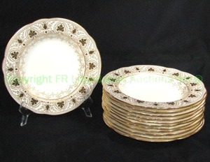 lot 739 image: Wedgwood England Dinner plates w oak leaf paneled rim and swag decoration. Loss to gilt, use marks, chip