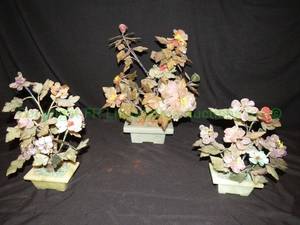 lot 731 image: Gemstone potted trees and flowers as show. Includes green celadon and marble or onyx bases