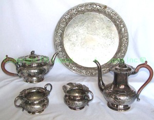 lot 848 image: Antique Sheffield EPNS hand chased silver plate serve ware w chocolate Bakelite handles and pomegranate finials c.1930