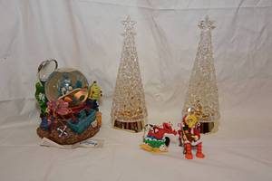 lot 107 image: Sesamme Street Christmas Ornaments, Two Light Up Glass Christmas Trees, Its A Bugs Life Snowglobe Music Box
