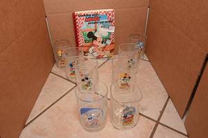 lot 138 image: Disney Glass Set, Disney Cookbook