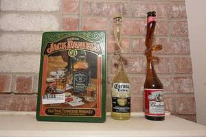 lot 150 image: Jack Daniels Tin CanBudweiser Twisted Bottle, Corona Twisted Bottle