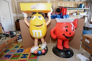 lot 2 image: 46 Tall Peanut M&M Decorative Ice and Drink Holder, 34 Tall Red Kool Aid Man Ice and Drink Holder