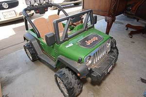 lot 15 image: Fisher Price Power Wheel, Green Jeep (Charger Included)
