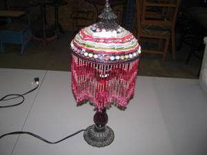 lot 42 image: Boho Desktop Beaded Lamp - casts a pink hue