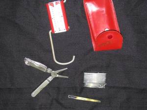 lot 81 image: Vintage leather travel scale, lighter, &amp tool