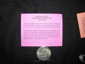 lot 99 image: Old Eisenhower Dollar, 1909 First Issue Lincoln Head Cent, 2000 Liberia Millennium $10 coin,