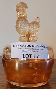lot 17 image: VINTAGE 1950S GLASS FRENCH POODLE POWDER BOX BY JEANNETTE ROUND MARIGOLD LUSTER COVERED DISH IN STYLE, COLOR, AND CONDITION SHOWN.