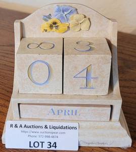 lot 34 image: DESKCOUNTER TOP CALENDAR IN STYLE, COLOR, AND CONDITION SHOWN.