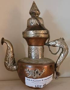 lot 98 image: ANTIQUE TIBETAN COPPER AND SILVER PLATE TEA POT WITH FIGURAL CEREMONIAL HANDLE IN STYLE, COLOR, AND CONDITION SHOWN.