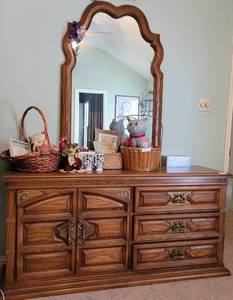 lot 205 image: VINTAGE WOOD DRESSER WITH MIRROR IN STYLE, COLOR, AND CONDITION SHOWN. CONTENTS NOT INCLUDED